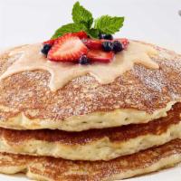 Lemon-Ricotta Pancakes · Our Buttermilk Pancakes with Ricotta Cheese and Lemon Zest. Topped with Fresh Strawberries