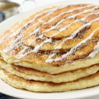 Cinnamon Roll Pancakes · Two Breakfast Favorites Are Even Better Together with Our Buttermilk Pancakes Swirled with C...