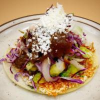 Cotija Taco · cotija patty, grilled seasonal veggies, chingon slaw, pasilla lime salsa.