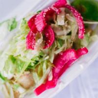 Crispy Chicken Tacos · Crunchy corn tortilla with shredded chicken breast topped with lettuce, pickled onions, and ...