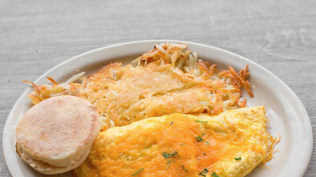 Cheese Omelet · Three eggs,  and shredded cheese. Served with toast and hash brown.