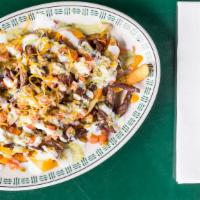 Carne Asada Fries · Our fries topped with carne asada, cheese, sour cream and pico de gallo.