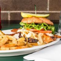 Bacon Bleu Cheeseburger · Burger topped with bleu cheese crumbles, bacon and grilled onions. Served with lettuce, toma...
