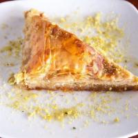 Baklava · Vegan. Cardamom rose water syrup and roasted pistachios layered in golden flaky layers of ph...