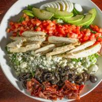 Tacoma Cobb Salad · Fresh salad mix topped with grilled chicken, egg, tomato, avocado, bleu cheese crumbles, bac...