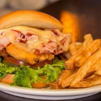 Ponderosa · Own luxury version of a chicken sandwich with breaded tenders, ham, and Swiss. Served with l...