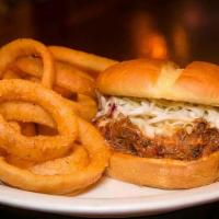 Bbq Pulled Pork Sandwich · Roasted pulled pork tossed with sweet and tangy BBQ sauce. Topped with traditional slaw on b...