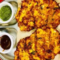 Vegetable Pakora · Mixed vegetables seasoned with spices and mixed in a homemade batter and deep fried.