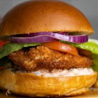 Fried Chicken Twist · Break from the burger with some crispy fried chicken topped, crispy lettuce, tomatoes served...