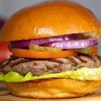 A Kind Of Classic · Taste the American Dream with our juicy American beef patty cooked medium and served on grid...