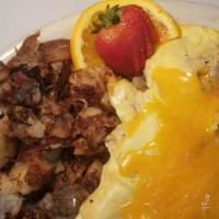 Meat Lovers Omelette · Bacon, sausage, ham, with cheddar cheese and your choice of 3 buttermilk pancakes, Fruit or ...