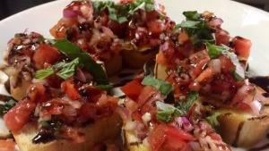 Bruschetta · Toasted Italian bread topped with diced tomatoes, onion, fresh basil and garlic, drizzled wi...