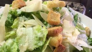 Caesar Salad · Crisp, fresh romaine lettuce mixed with creamy caesar dressing topped with croutons and shav...