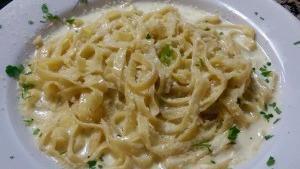 Fettuccine Alfredo · Our house made alfredo sauce tossed with fettuccine pasta.