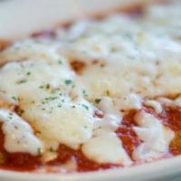 Chicken Parmesan · Breaded chicken breast topped with marinara sauce and Mozzarella cheese.