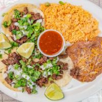 Combo #9 - 3 Tacos De Asada Con Aroz / Frijol  · Three soft grilled steak tacos with cilantro, onions, lime and salsa.