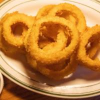 Onion Rings · Thick cut and fried golden with house ranch dressing.
