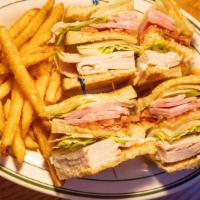 Clubhouse Sandwich · This sandwich offers corned beef, swiss cheese, sauerkraut and thousand island on grilled ry...