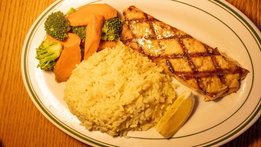 Grilled Salmon · Lightly seasoned and charbroiled to perfection.