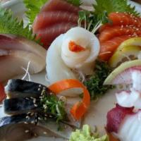 Deluxe Sashimi Platter · Three pieces each tuna salmon flounder and two pieces each of yellowtail octopus mackerel sa...
