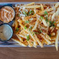 Loco Fries · Fries with cotija cheese, chipotle parmesan seasoning & topped with fresh cilantro. Served w...