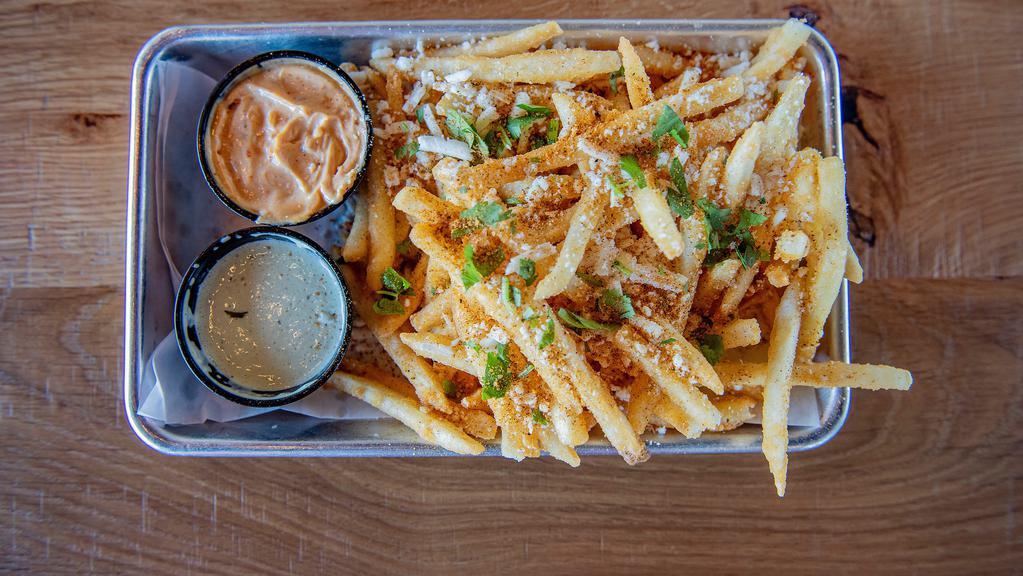 Loco Fries · Fries with cotija cheese, chipotle parmesan seasoning & topped with fresh cilantro. Served with jalapeno ranch & chipotle crema.