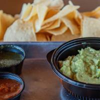 Guacamole & Chips · Fresh guacamole, house-made tortilla chips. Served with green salsa & red salsa.