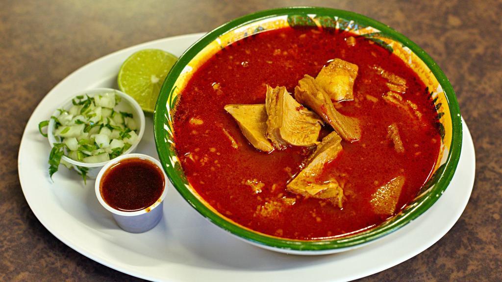 Menudo · Pancita (tripe) soup, served with tortillas, cilantro, onion, lemons and red sauce.