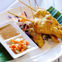 Chicken Satay Apptizer · Skewered grilled chicken marinated in Thai spices,
served with cucumber salad &Thai style pe...