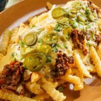 Chili Cheese Fries · loaded with hot dog chili sauce made in Michigan, sliced America cheese and mustard.