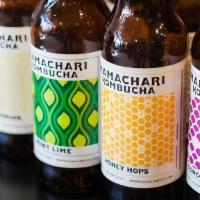 Mamachari Kombucha  · Locally brewed kombucha- Aloha, Concord Grape, Mint Lime, Lemon Ginger, Blue Moscow, Tart Ch...