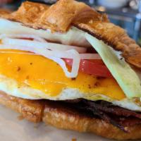B-Fast Sammie · Grilled sandwich with 2 eggs, protein choice, cheddar, and home fries