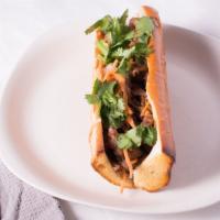 (Heo Nướng) Grilled Pork Banh Mi · Grilled lemongrass pork, house made mayo, pate, pickled carrot and daikon, cucumber, cilantr...