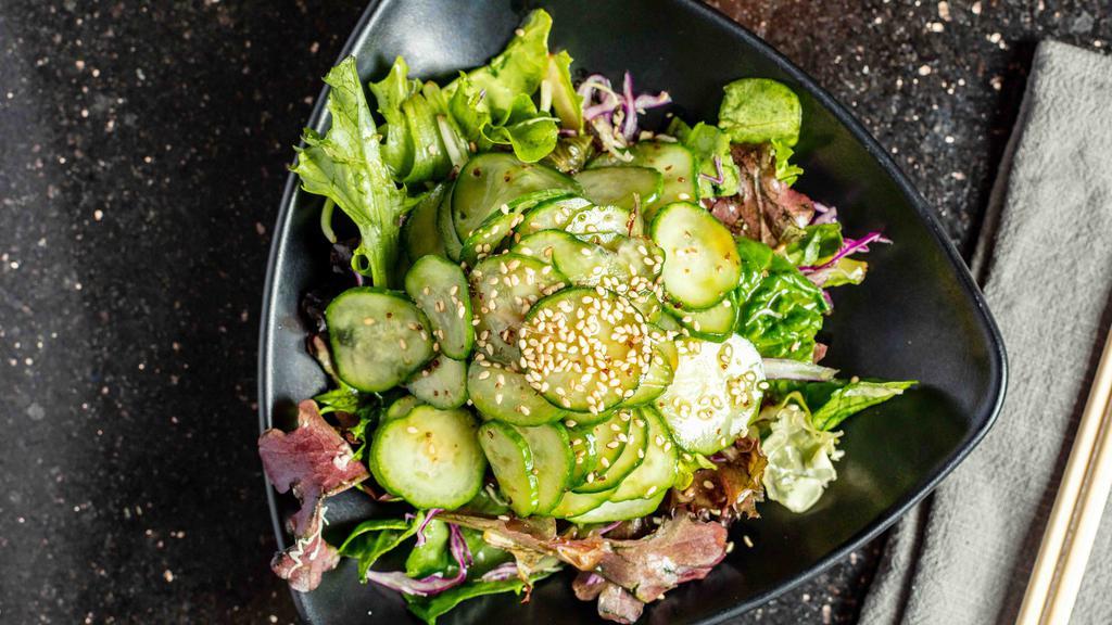 Cucumber Salad · Marinated cucumber in Japanese sweet vinegar over fresh greens.