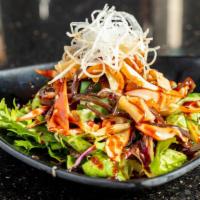 Spicy Squid Salad · Marinated squid in sweetly spicy sauce over greens.