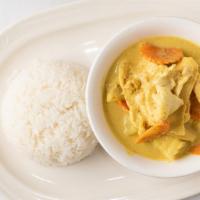 Yellow Curry · Spicy yellow curry with coconut milk, potatoes, carrots, and tomatoes. Served with steamed j...