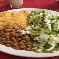 Green Enchiladas  · Three enchiladas with creamy spicy green sauce stuffed with chicken, topped with cheese, let...