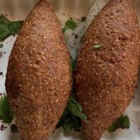 Kibbeh · Cone-shaped croquettes of organic beef and bulgur wheat filled with seasoned organic ground ...
