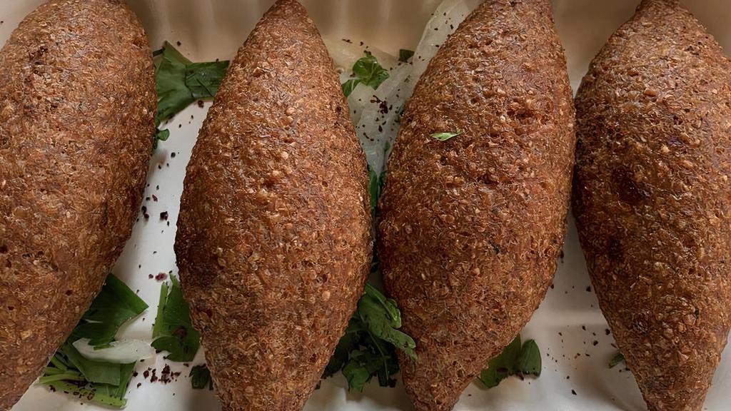 Kibbeh · Cone-shaped croquettes of organic beef and bulgur wheat filled with seasoned organic ground beef, onion and pine nuts (deep-fried).