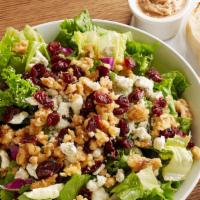 Cranberry Bleu Salad · Salad greens topped with tangy cranberries, crumbled bleu cheese and candied walnuts. Served...