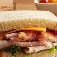 Club · Honey wheat. Oven-roasted turkey breast and Virginia baked ham topped with bacon, tomato, an...