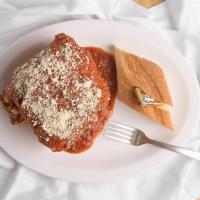 Lasagna · A giant slice of Auntie's best, chock full of ricotta, mozzarella, sausage, and meatballs se...