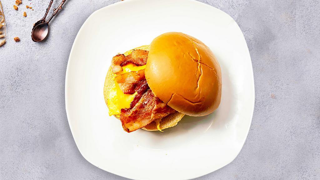 Bring Home The Bacon Breakfast Sandwich · Scrambled egg, bacon, and cheddar cheese on your choice of bread.