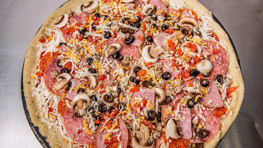 The Legend · Marinara, Mozzarella, pepperoni, salami, Canadian bacon, sausage, mushroom, olive, onion, and tomato, topped with Colby Jack cheese.