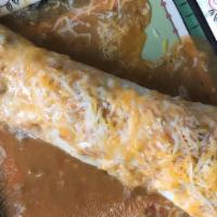 Breakfast Burrito · Eggs, potatoes, cheese, smothered with green chile.