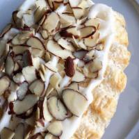Bear Claws · 2 mini bear claws topped with delicious cream cheese icing drizzle and sliced almonds.