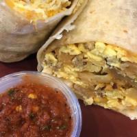 Roasteritto · Scrambled eggs, shredded cheese blend. Sausage, seasoned potatoes and green chiles. Served w...