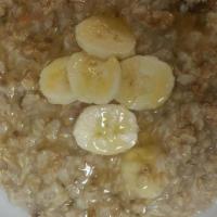 Banana Bread Oatmeal · Slow cooked rolled oats with sliced banana, honey, walnuts and brown sugar.