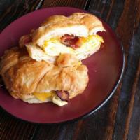 Frenchman · Scrambled eggs, cheddar cheese and bacon served on a buttery croissant.
