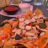 Ultimate Nachos · Vegetarian and gluten free. Corn tortilla chips refried beans melted cheddar jack fresh pico...